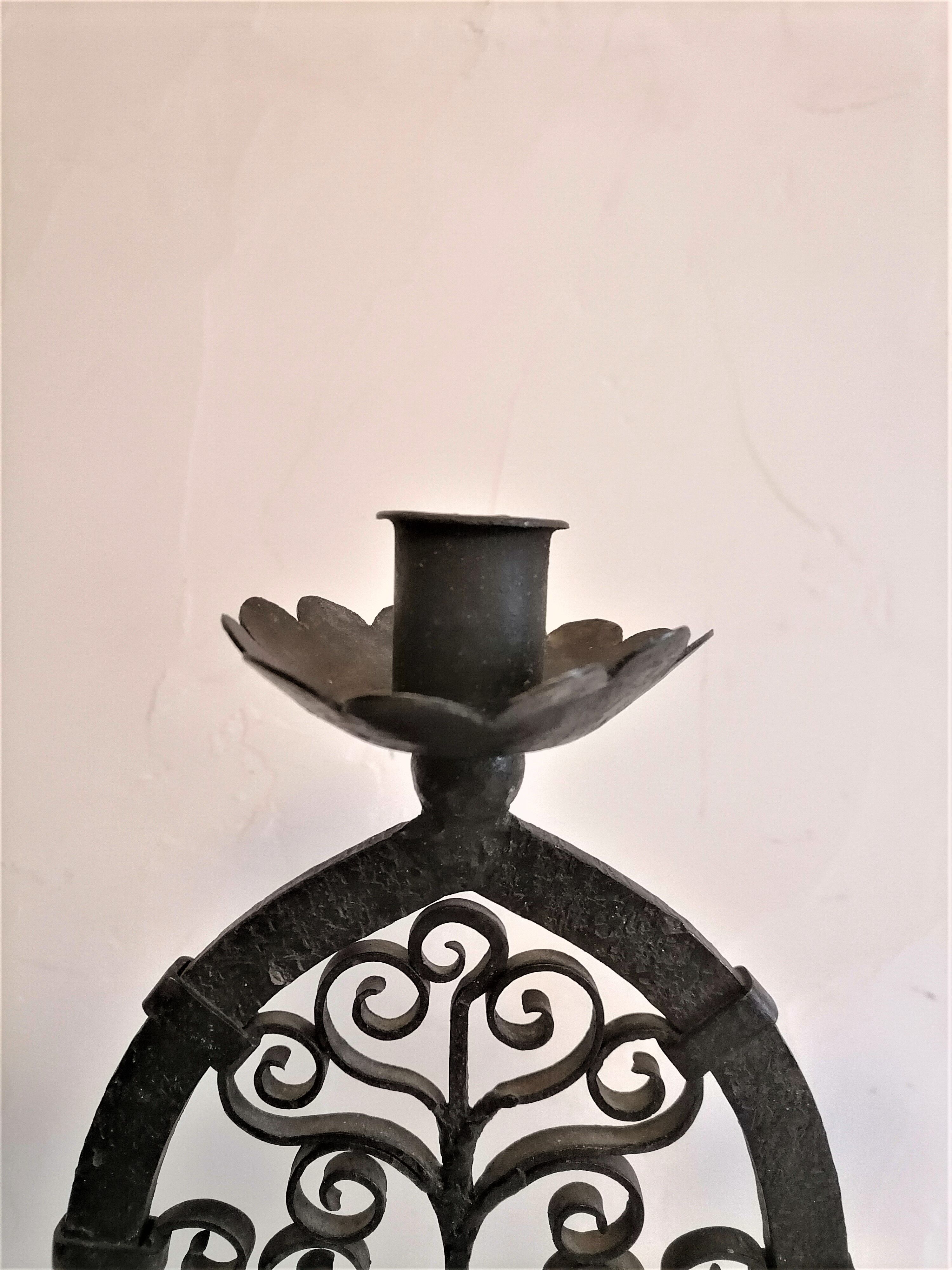 Pair of wrought iron candelabras. Mid-twentieth century.