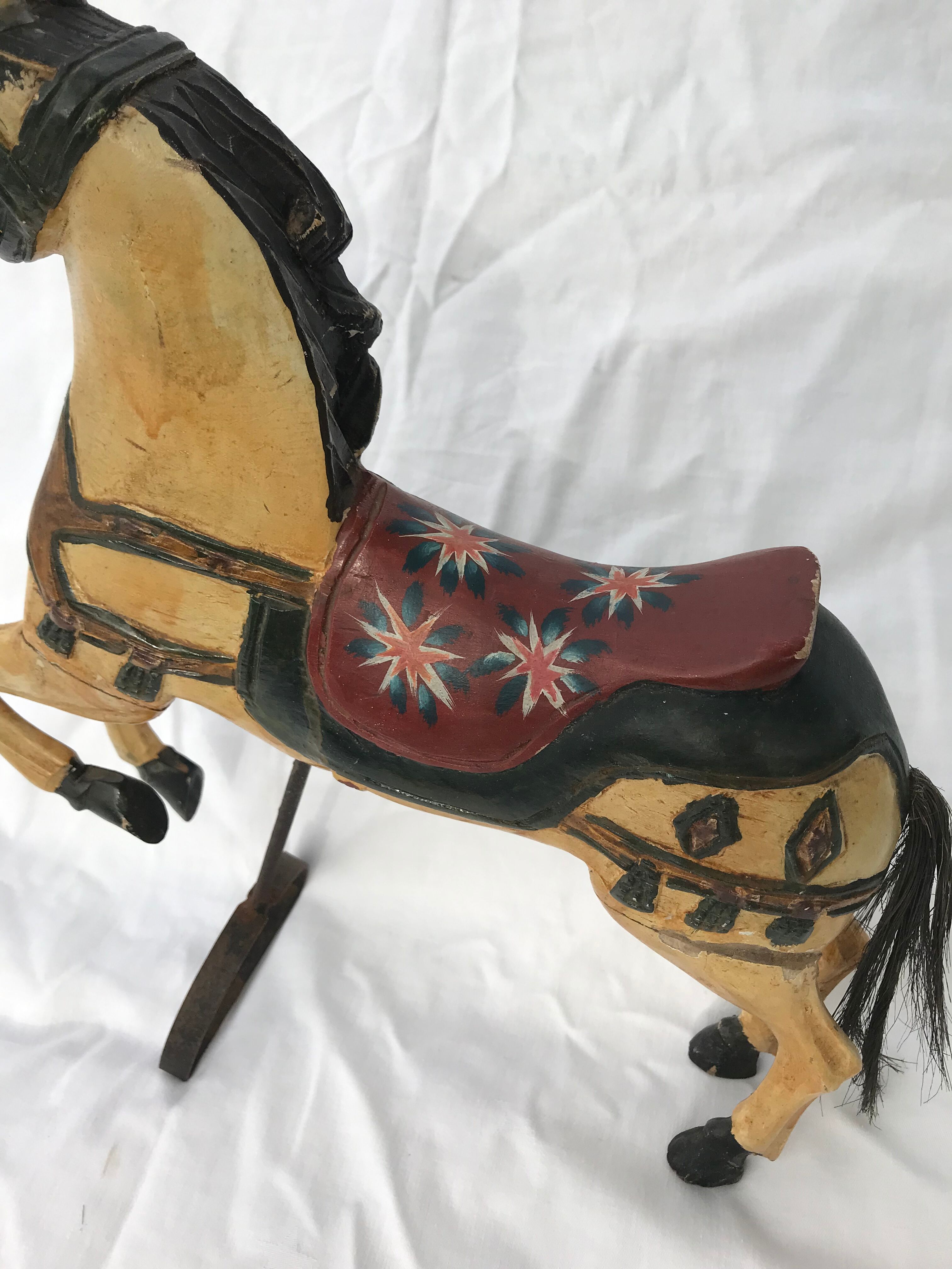 Wooden horse with period ironwork support