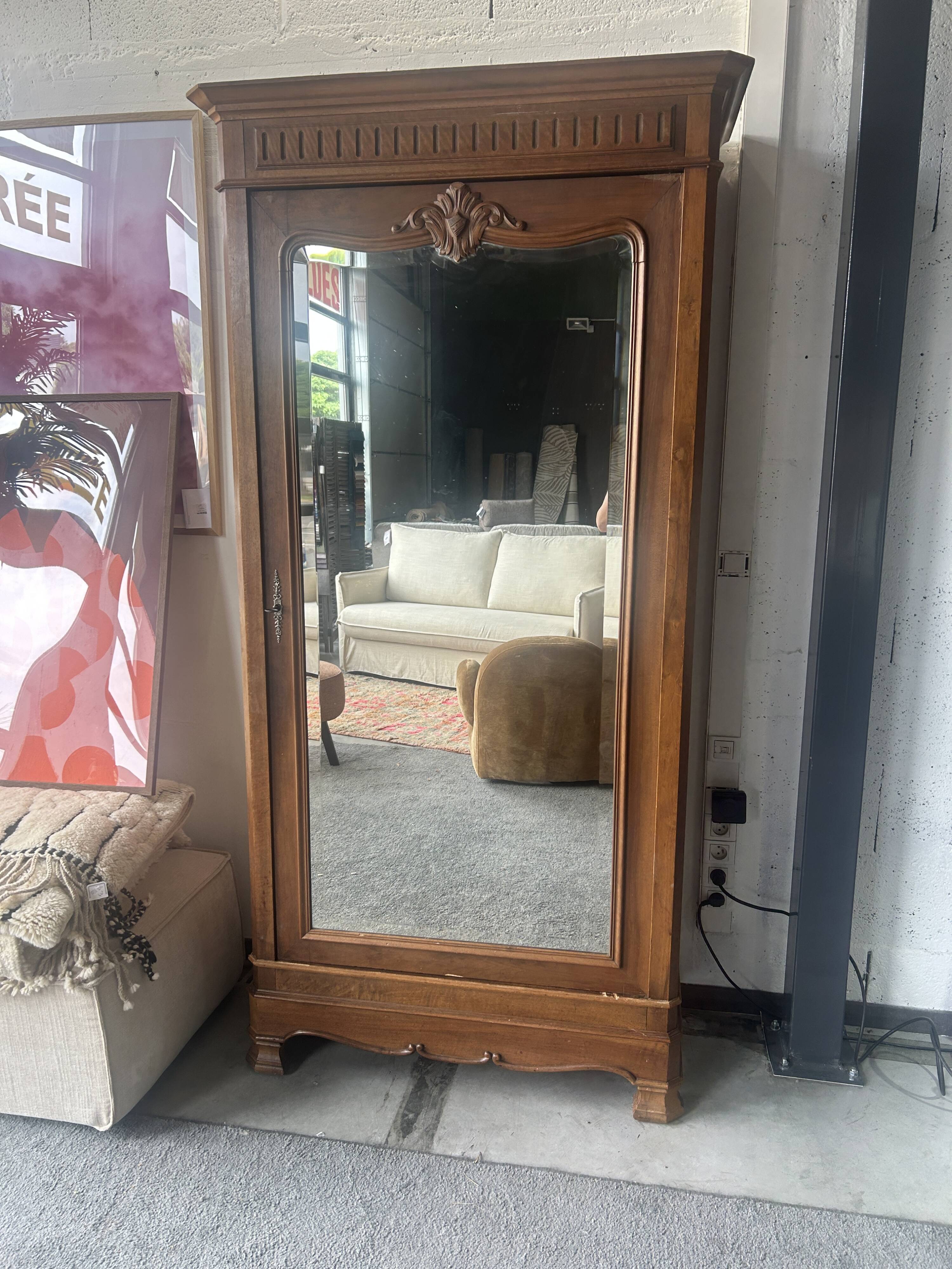 Antique Louis-Philippe walnut veneered wardrobe with an antique mirror.