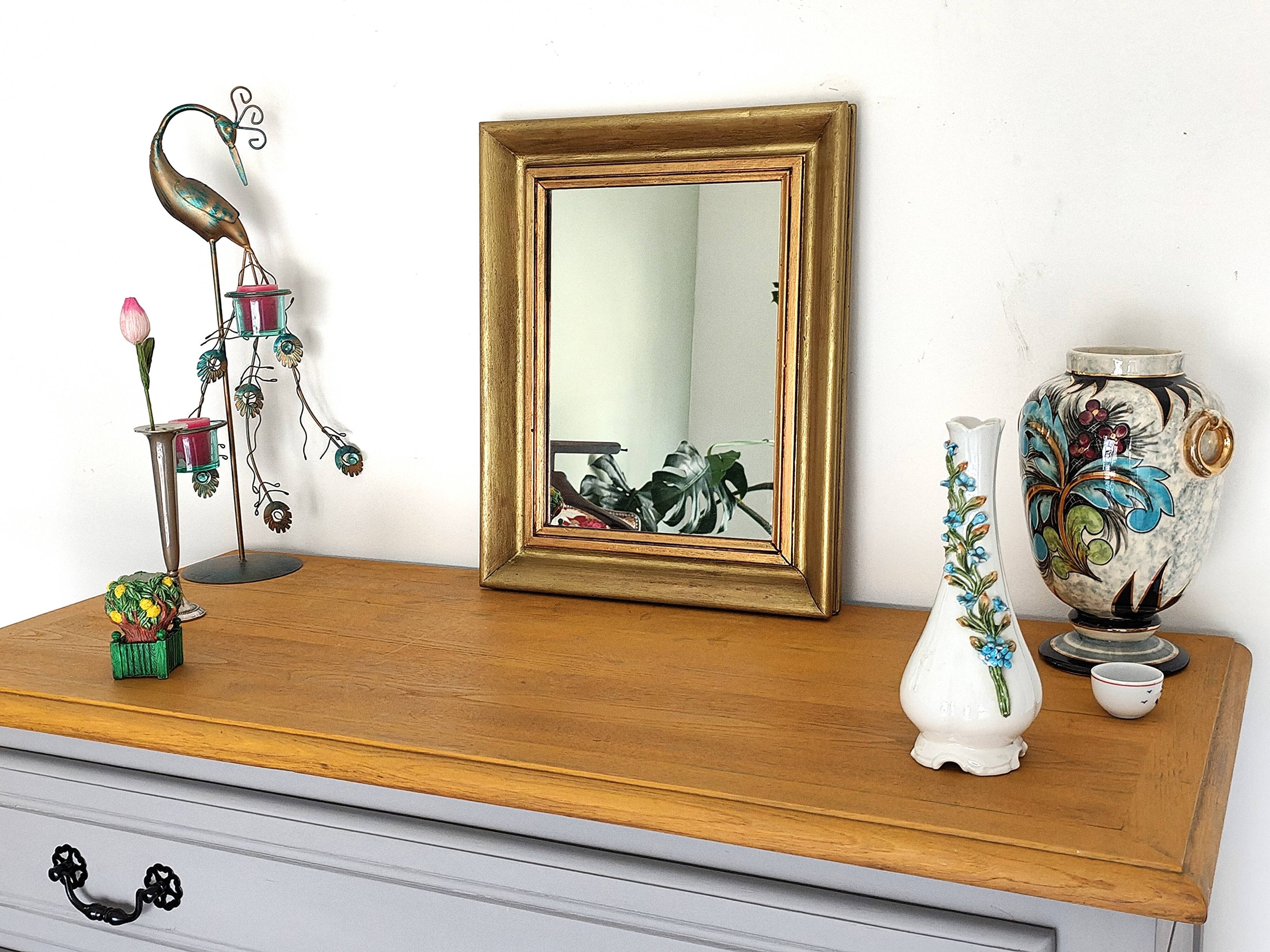 Antique mirror in gilded and copper wood