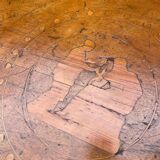 Antique round marquetry Empire table from the early 19th century