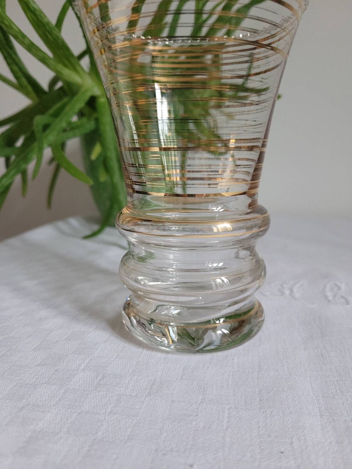 Flared glass vase with gold trim