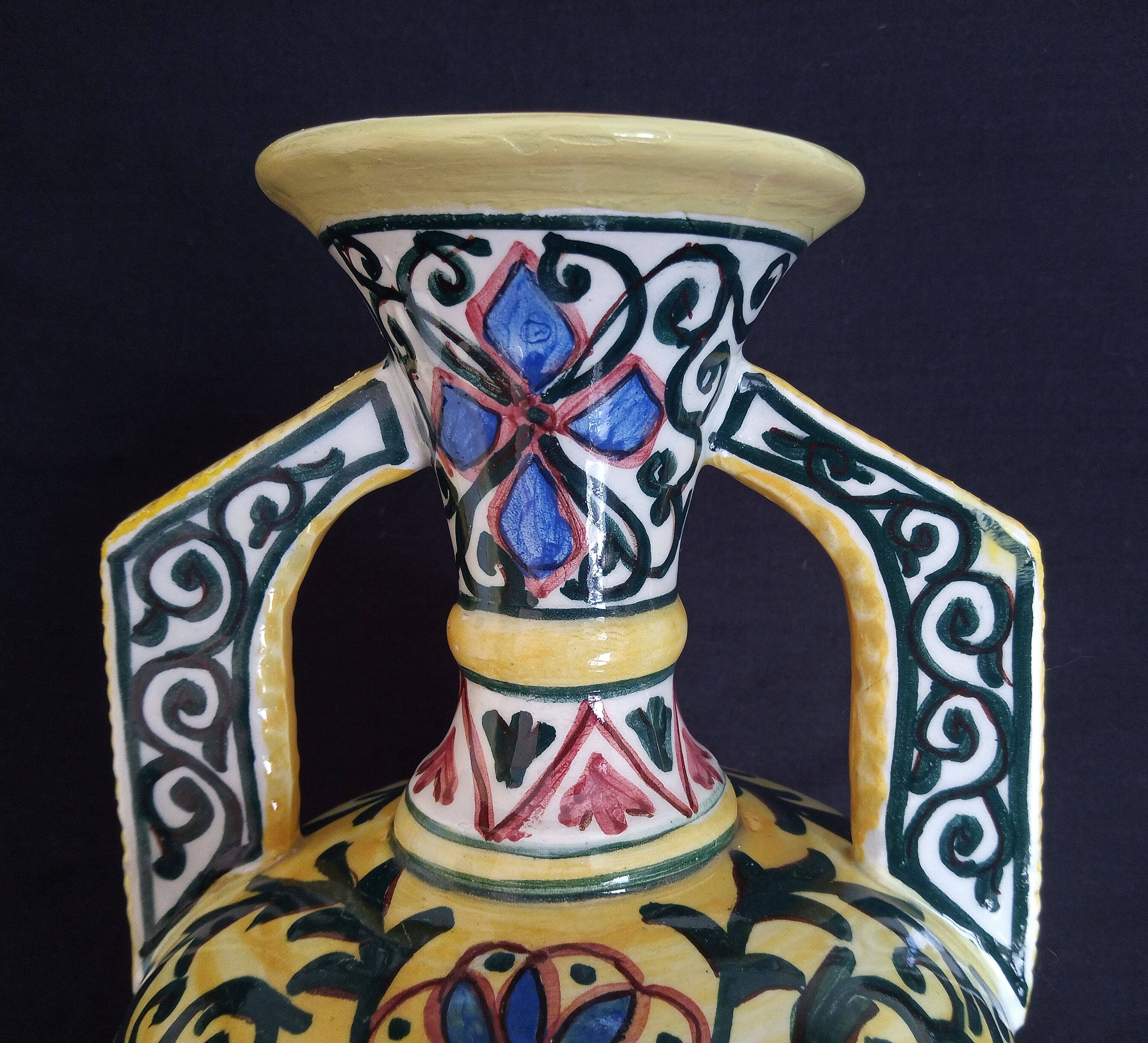 Art Deco ceramic vase with brightly colored abstract patterns
