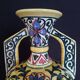 Art Deco ceramic vase with brightly colored abstract patterns
