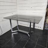 Chromed metal table with smoked glass top