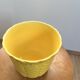 Yellow ceramic plant pot