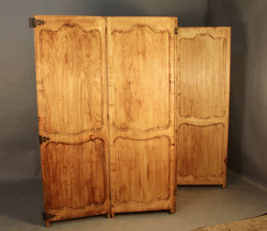 Large cherry wood folding screen with four double-sided panels.