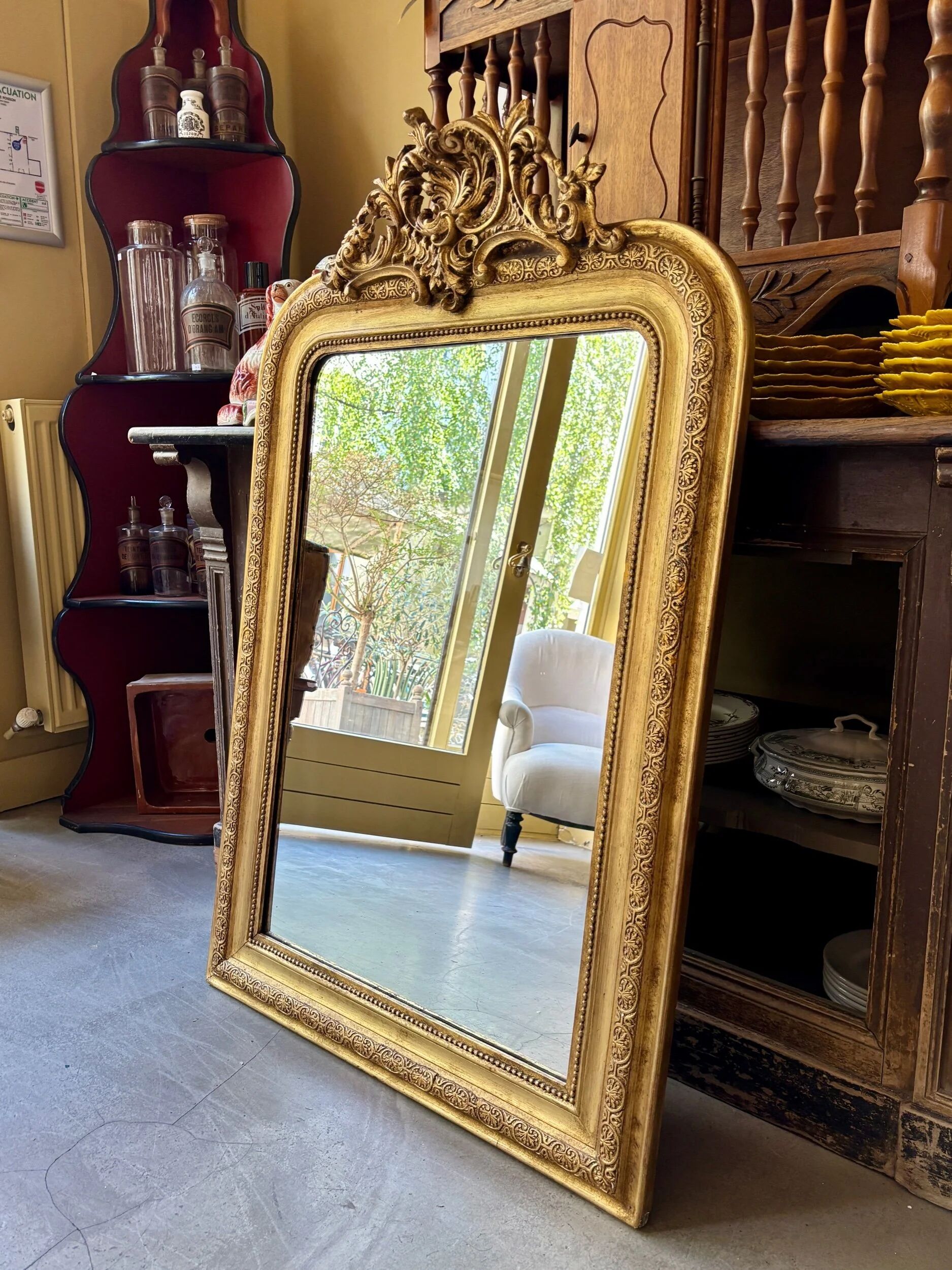 Gold sculpted and moulded stucco trumeau mirror 113 x 78 cm