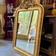 Gold sculpted and moulded stucco trumeau mirror 113 x 78 cm