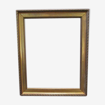 Old wooden and gilded stucco frame