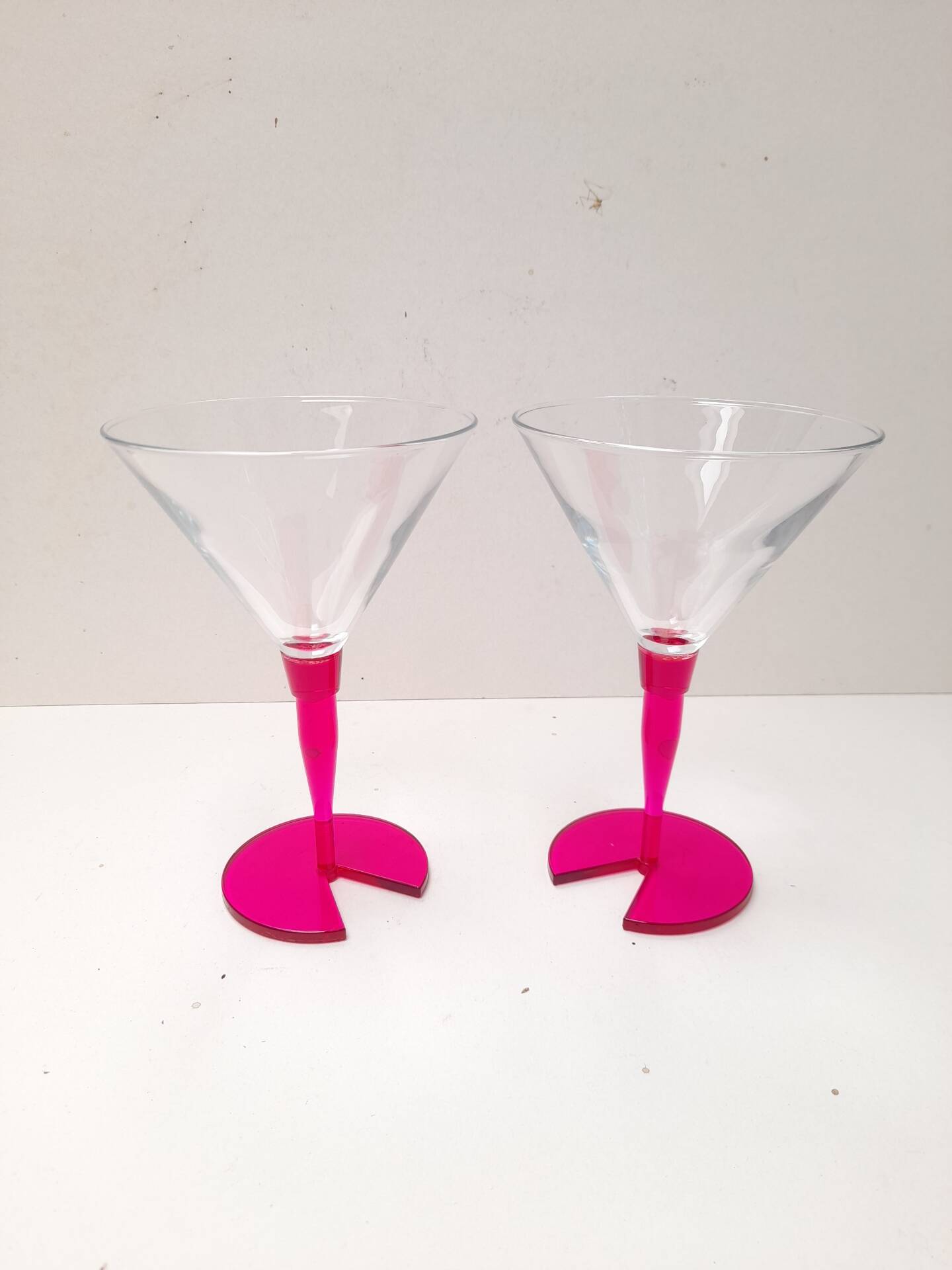 Pair of bright pink cocktail glasses from the 80s.