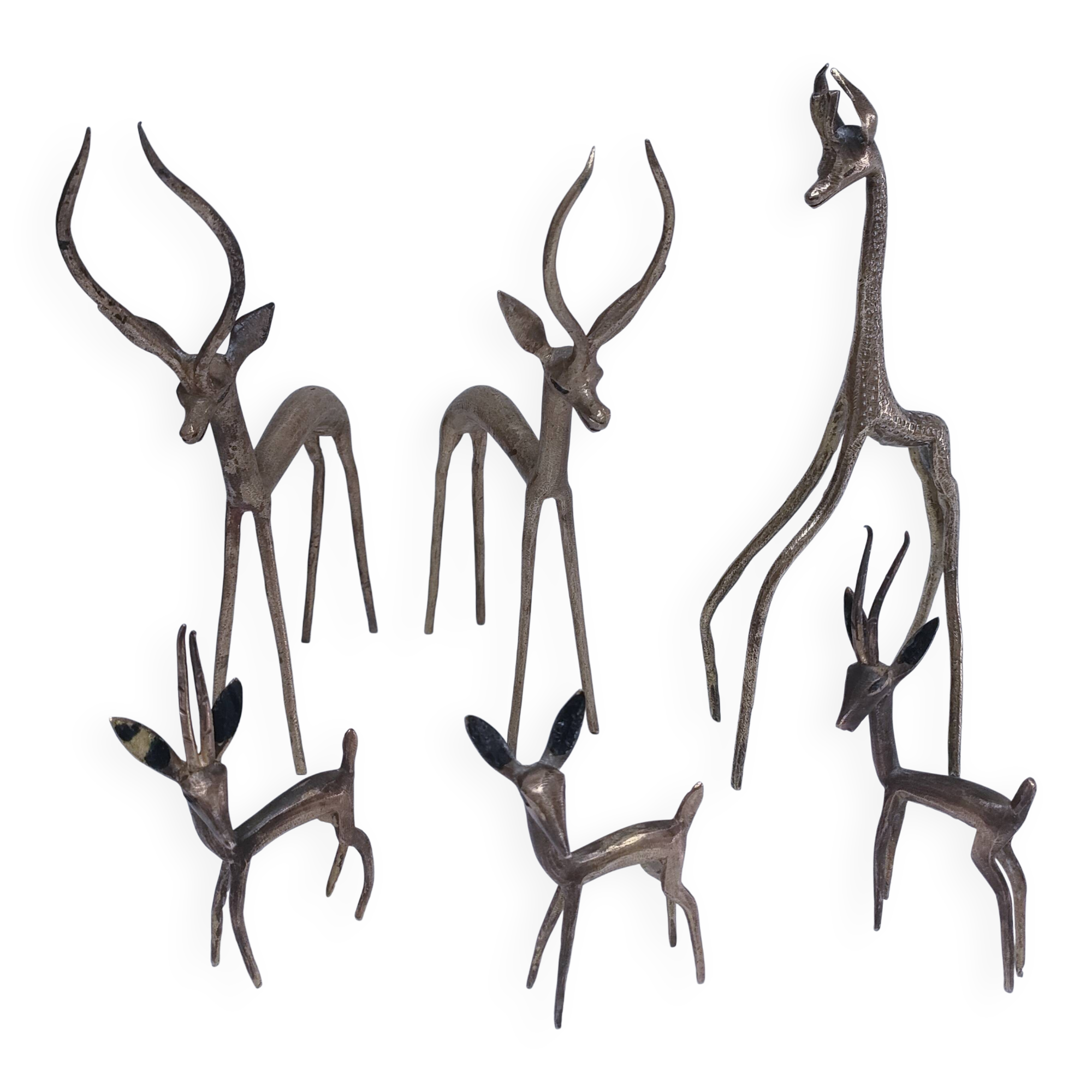 five vintage brass sculptures of gazelles, antelopes, and a giraffe
