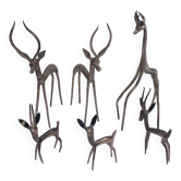 five vintage brass sculptures of gazelles, antelopes, and a giraffe