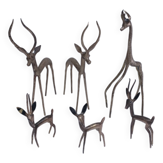 five vintage brass sculptures of gazelles, antelopes, and a giraffe