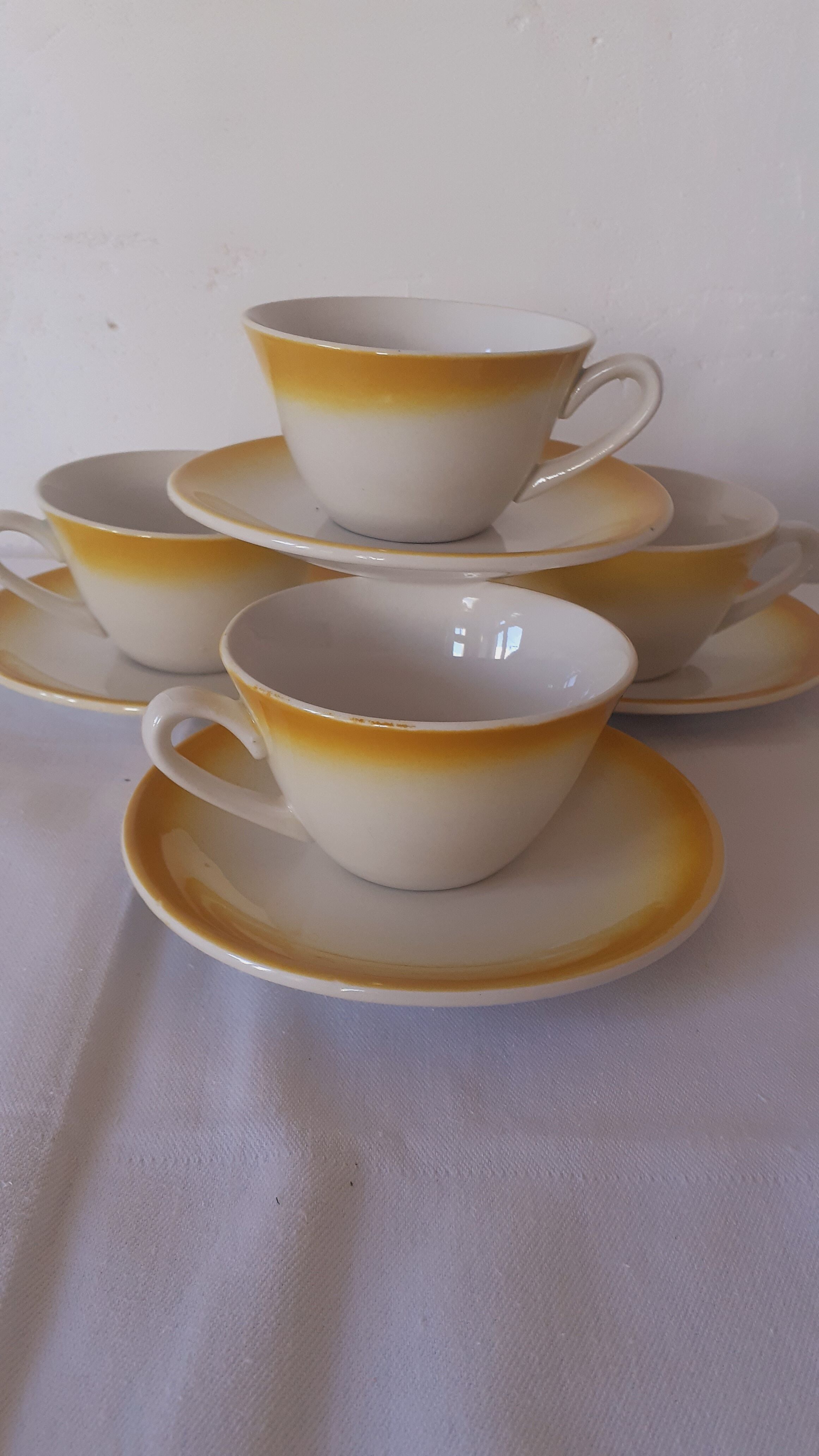 Yellow and white coffee cups