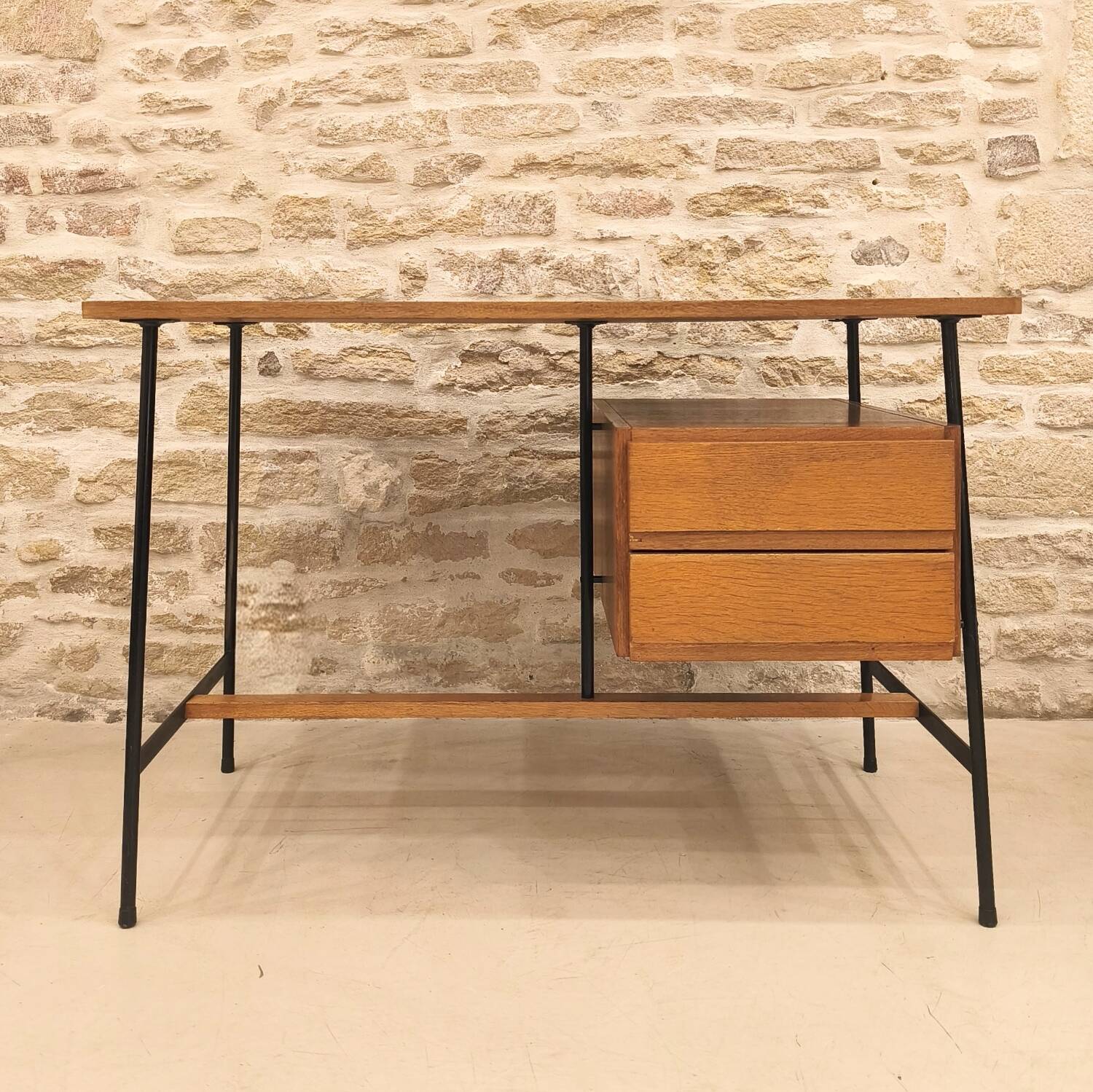 Modernist desk with suspended drawer unit, French work from the 1950s.