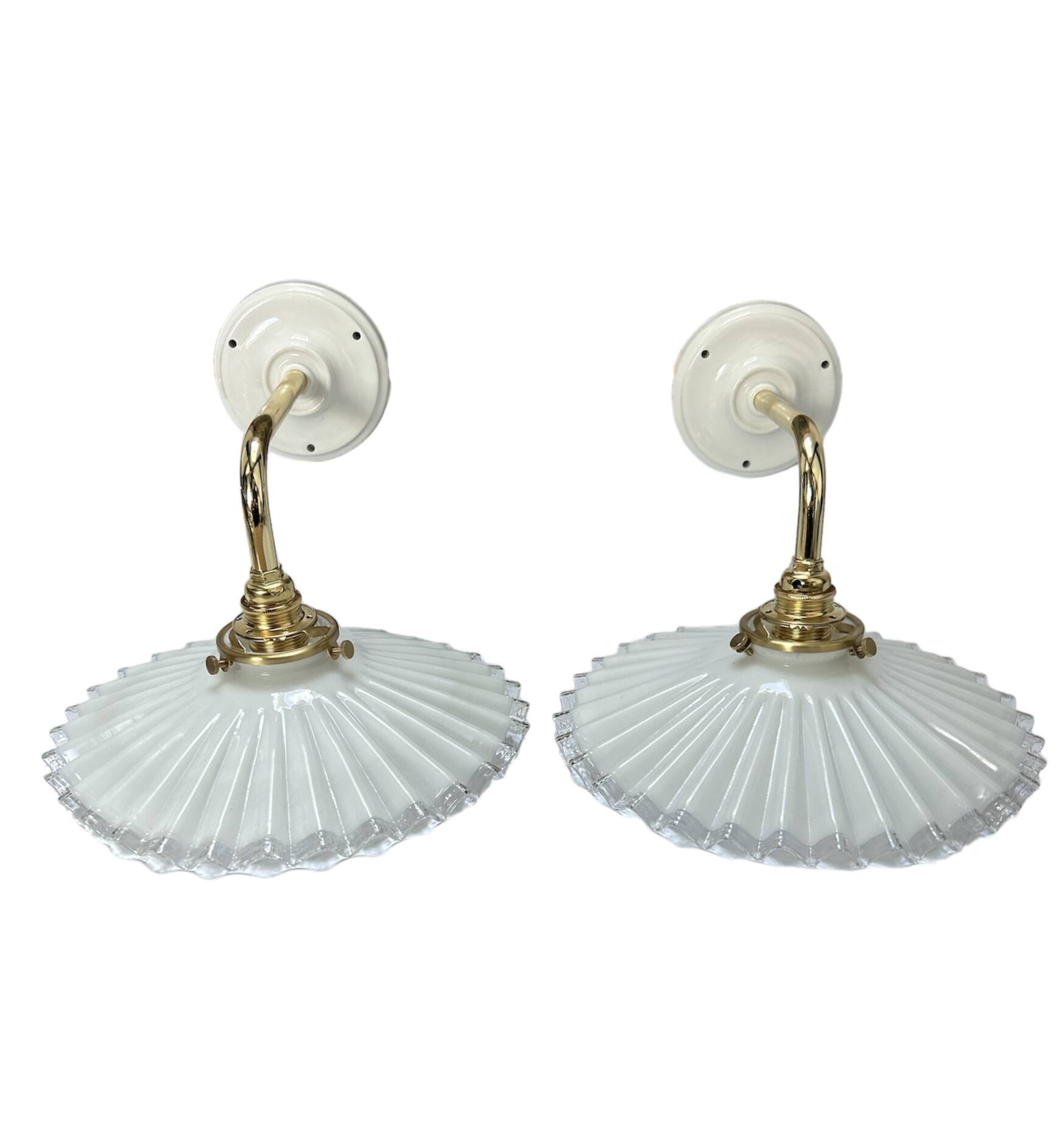 Two wall sconces in serrated white opaline