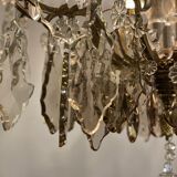 Golden bronze luster garnished with transparent and mordoréed pampilles