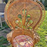 Vintage peacock chair in sculptural blonde rattan, fan back from the 1970s.