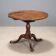 Small antique walnut table with a round top, United Kingdom, 19th century.
