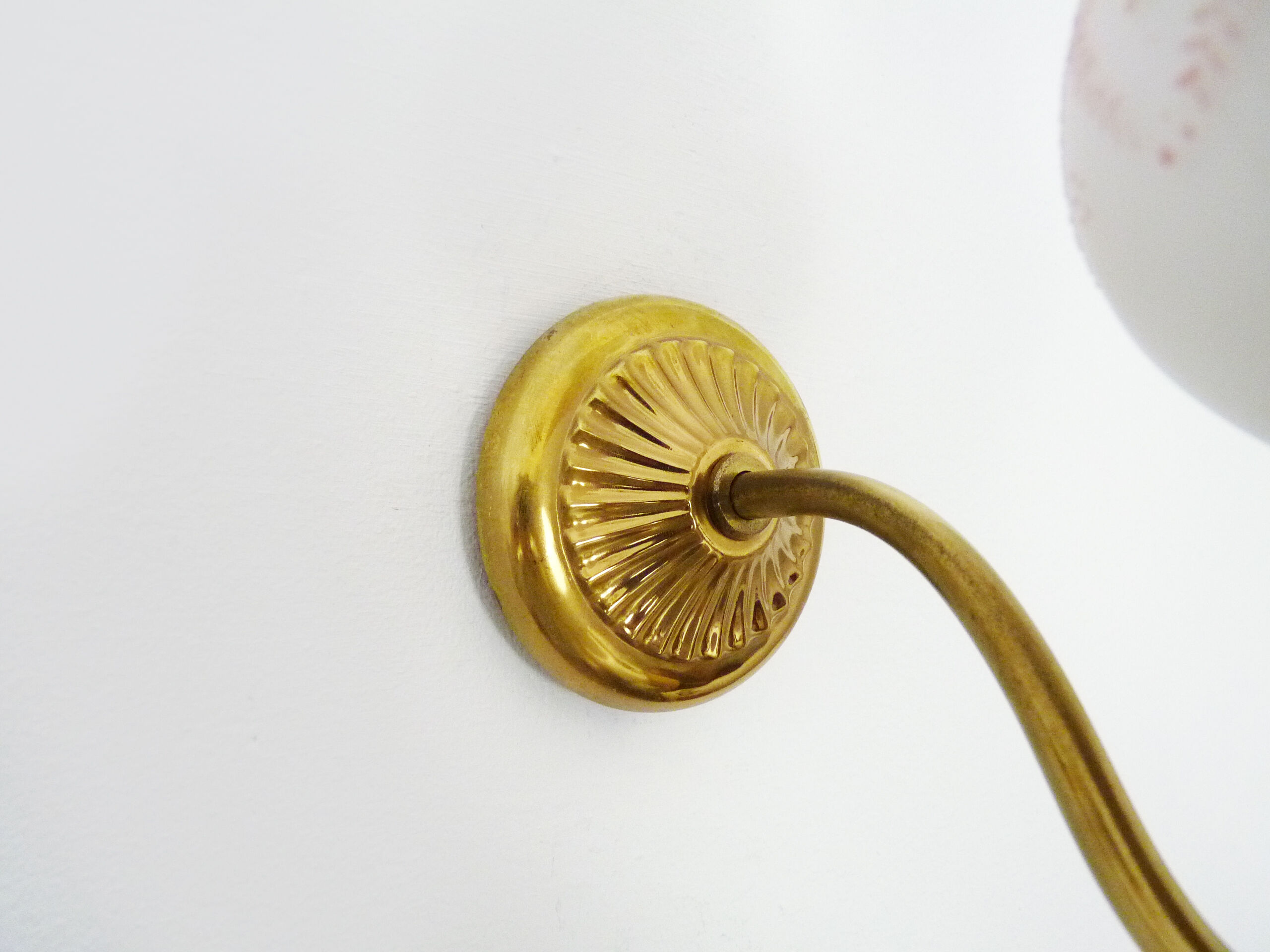 Pair of gooseneck wall sconces in gilded metal, white opaline with pink decorations