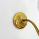 Pair of gooseneck wall sconces in gilded metal, white opaline with pink decorations