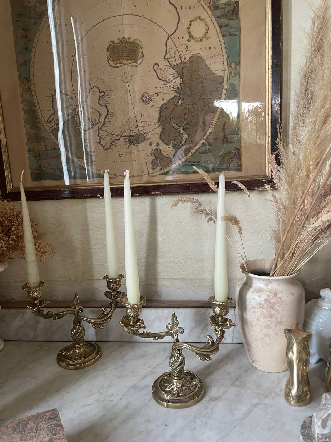 Pair of rocaille candlesticks in gilded bronze