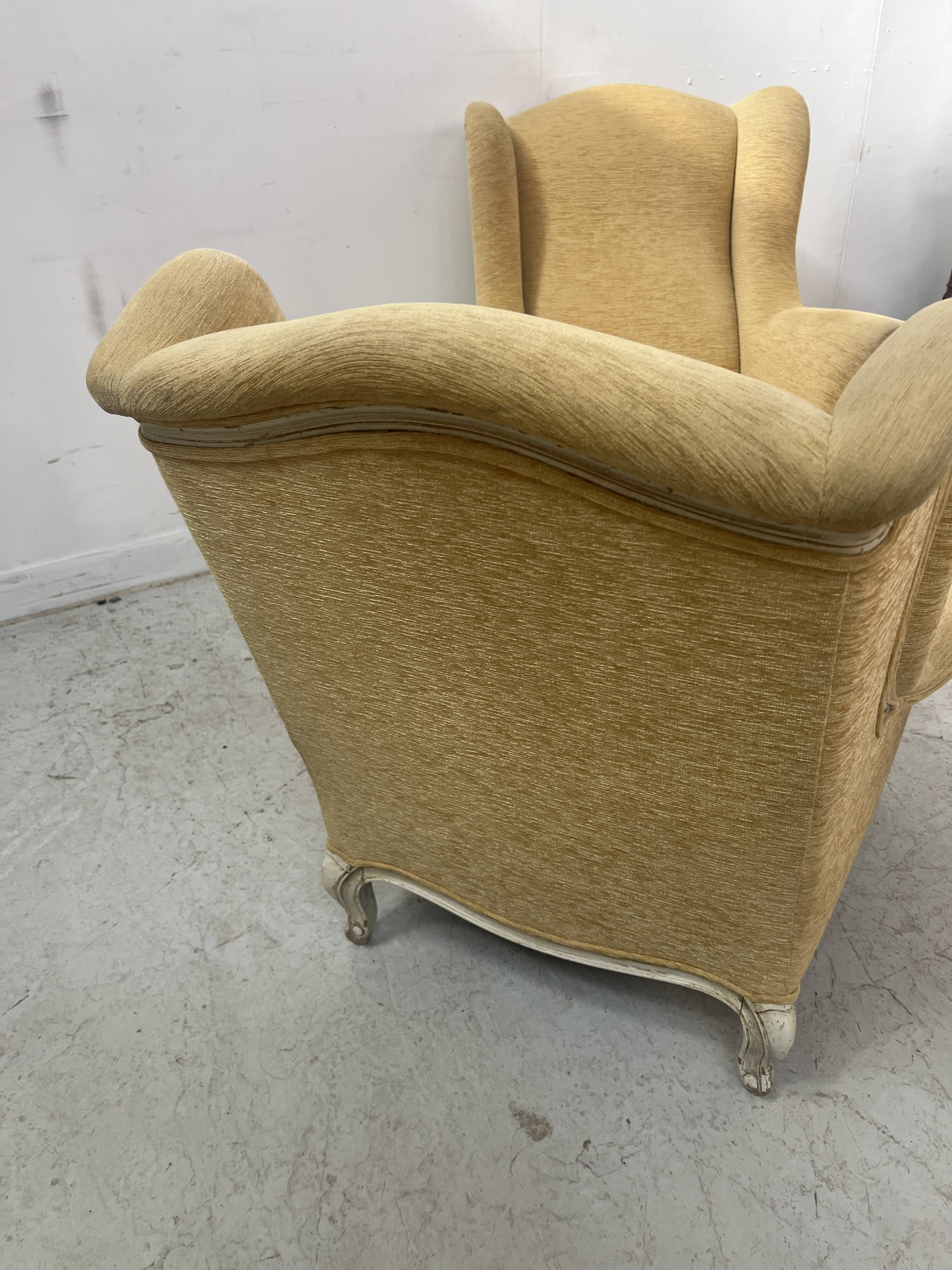 Pair of Louis XV style wing chairs in patinated beech, 20th century