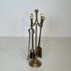 Neoclassical brass fire accessory.