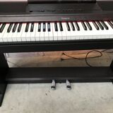 Roland HP 700 keyboard and its stand with pedal