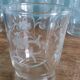 Old digestif or liqueur glasses, handcrafted glass with a floral pattern.