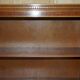 Corner library made of flamed hardwood, in 3 parts.