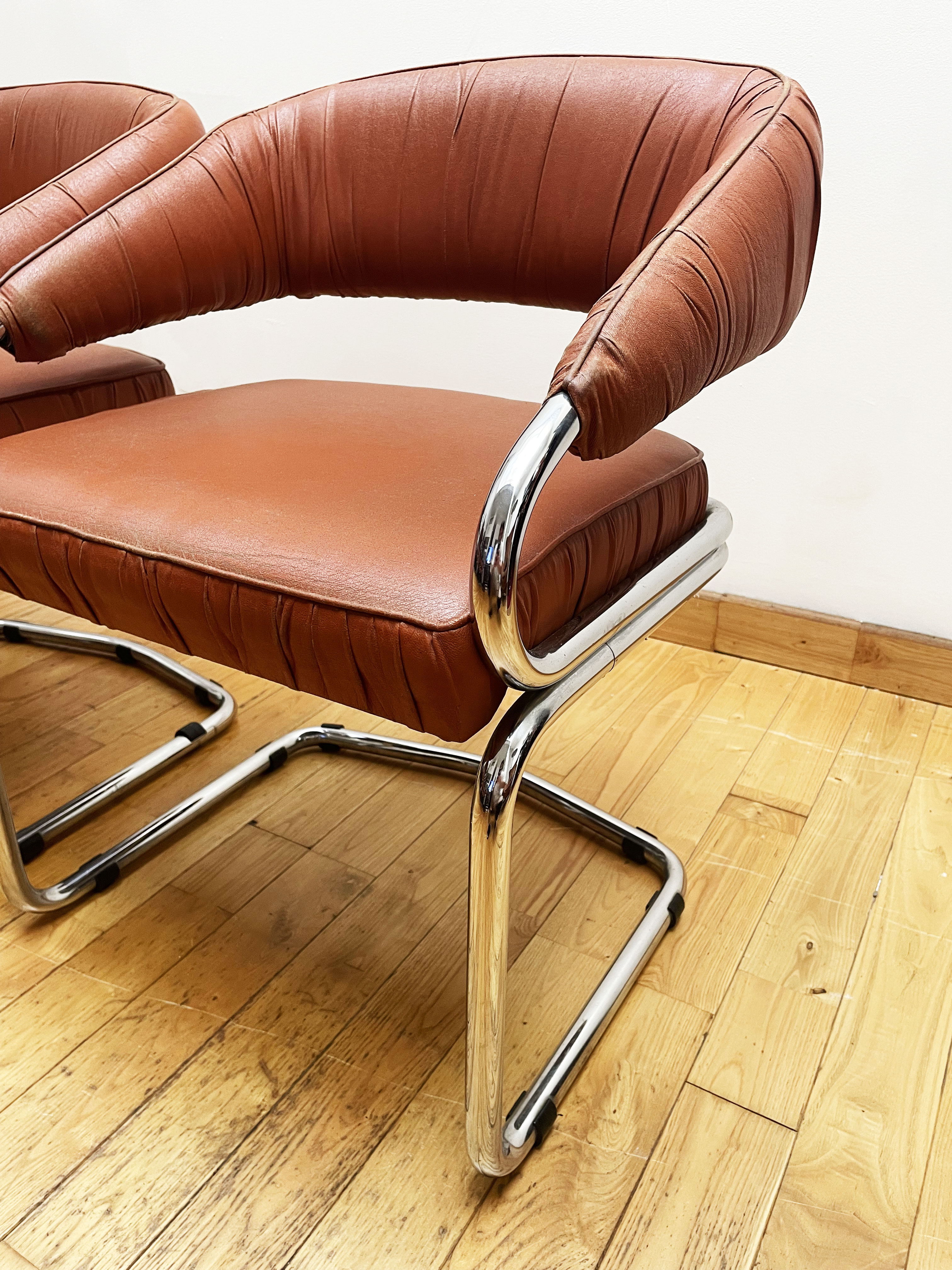 Pair of leather armchairs year 70