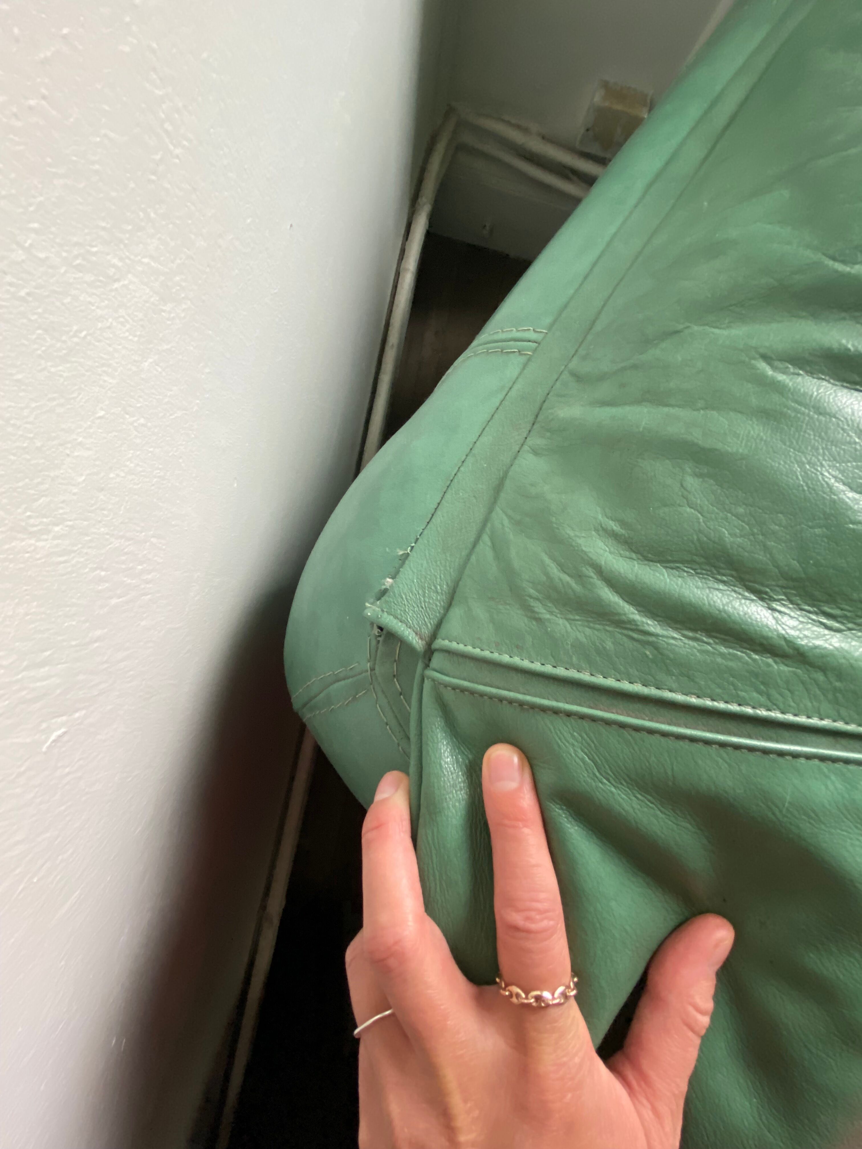 New armchair in vintage green leather