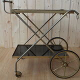 Rolling dessert in gold metal and trays in black formica