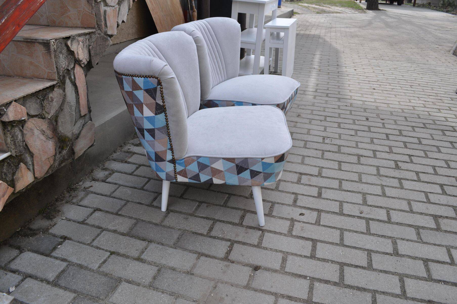 Set of 2 vintage multicoloured cocktail chairs in fabric and wood from the 1950s.