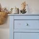 Handcrafted blue chest of drawers.