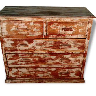 Commode en teck patinée.