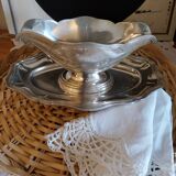 Sauce boat on a scalloped tray in silver metal