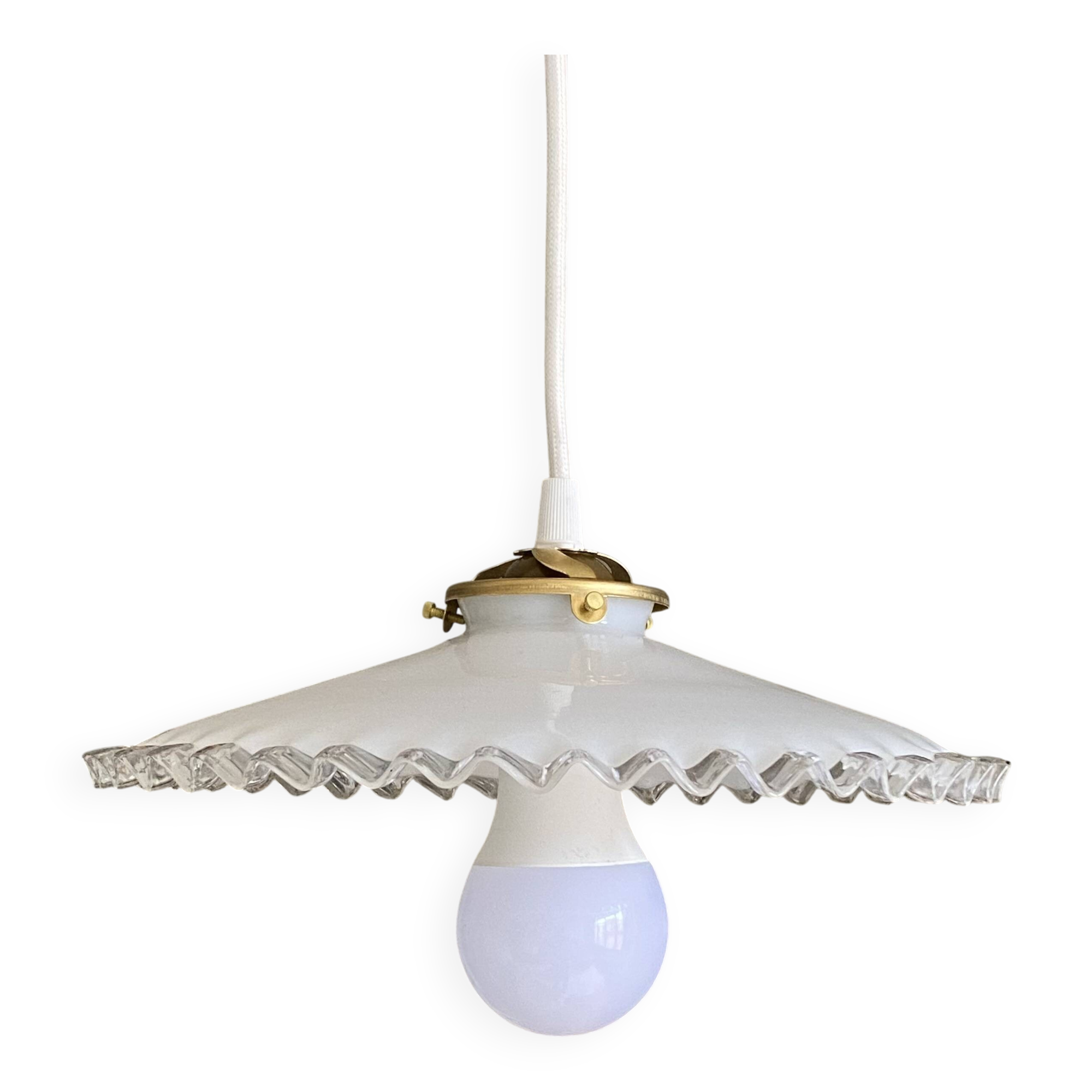 Old lampshade in white opaline glass with a wavy edge.