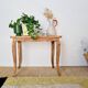 Antique coffee table with curved legs.