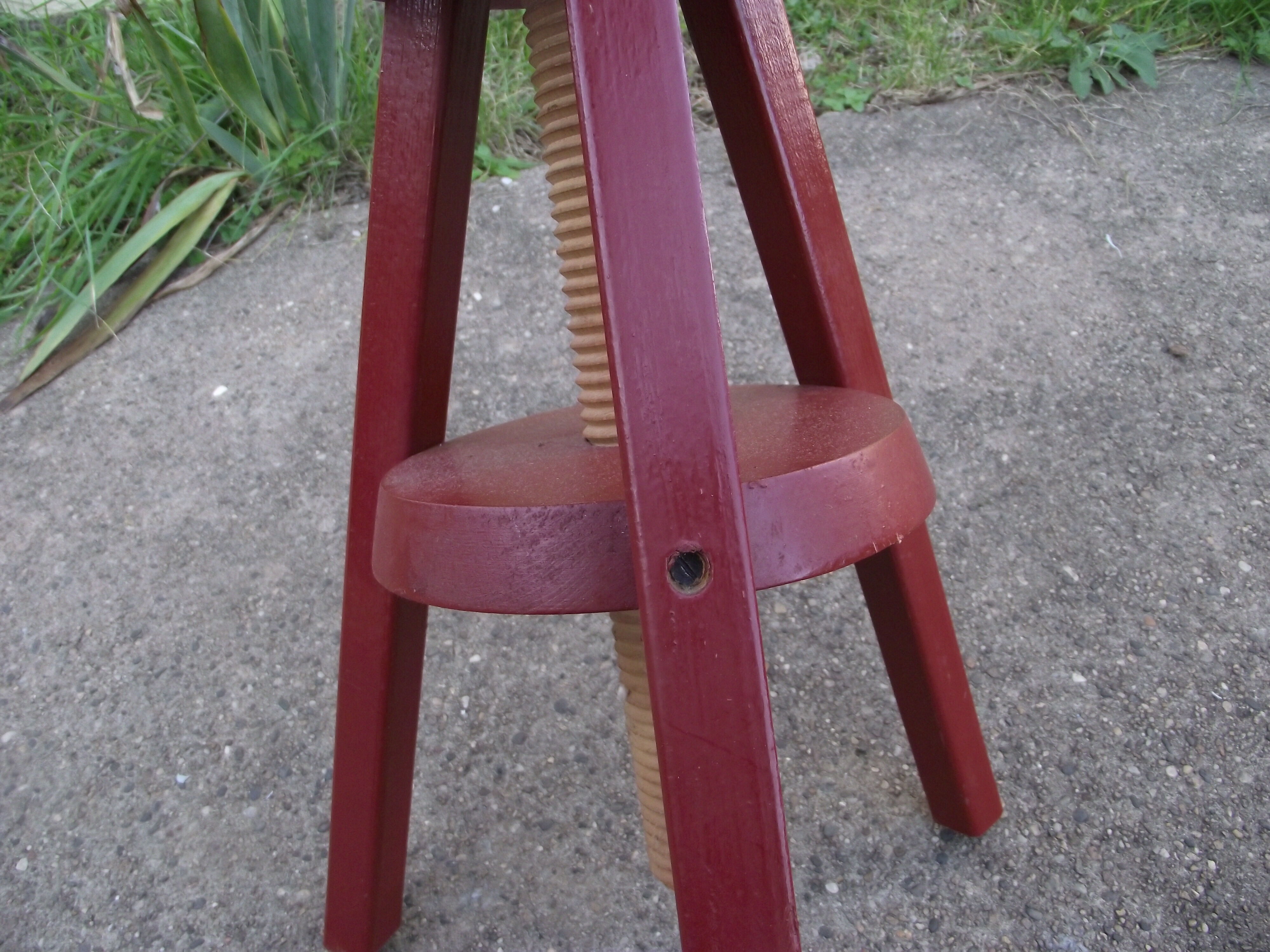 Wooden stool with high adjustable screw
