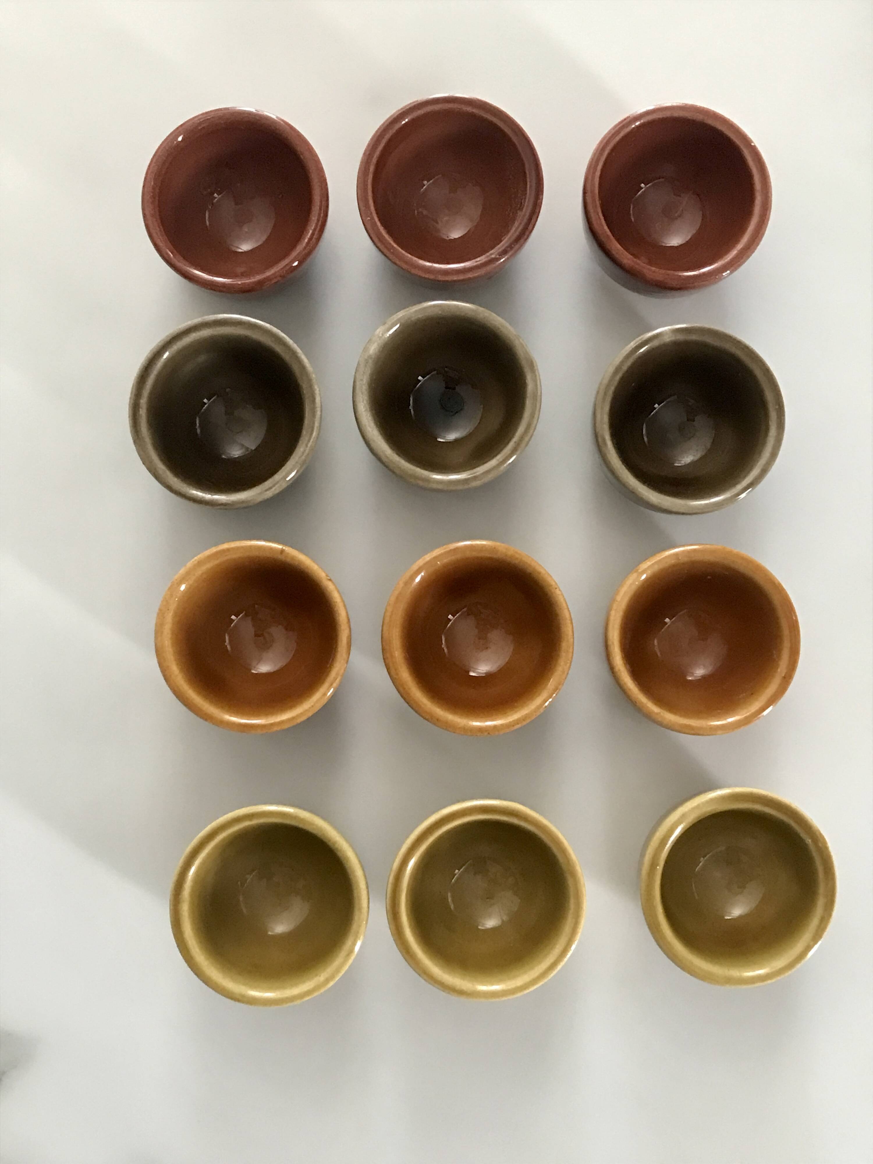 Set of 12 small multi-colored ceramic candle holders