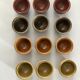 Set of 12 small multi-colored ceramic candle holders