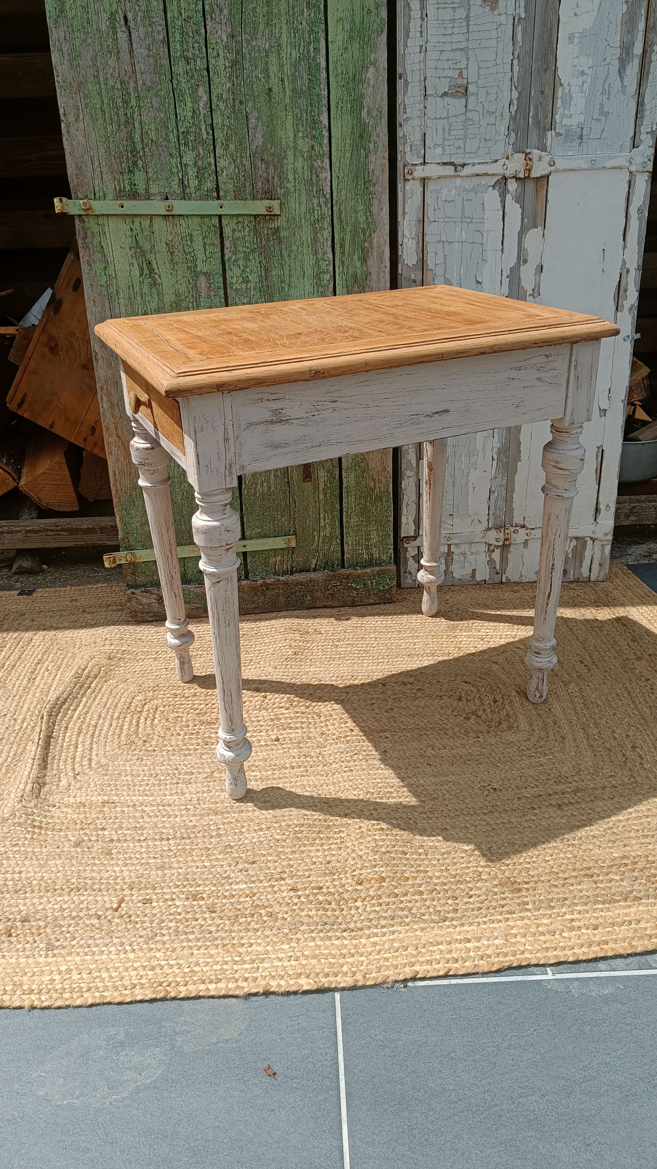 Antique drawer table with a patina.