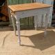 Antique drawer table with a patina.