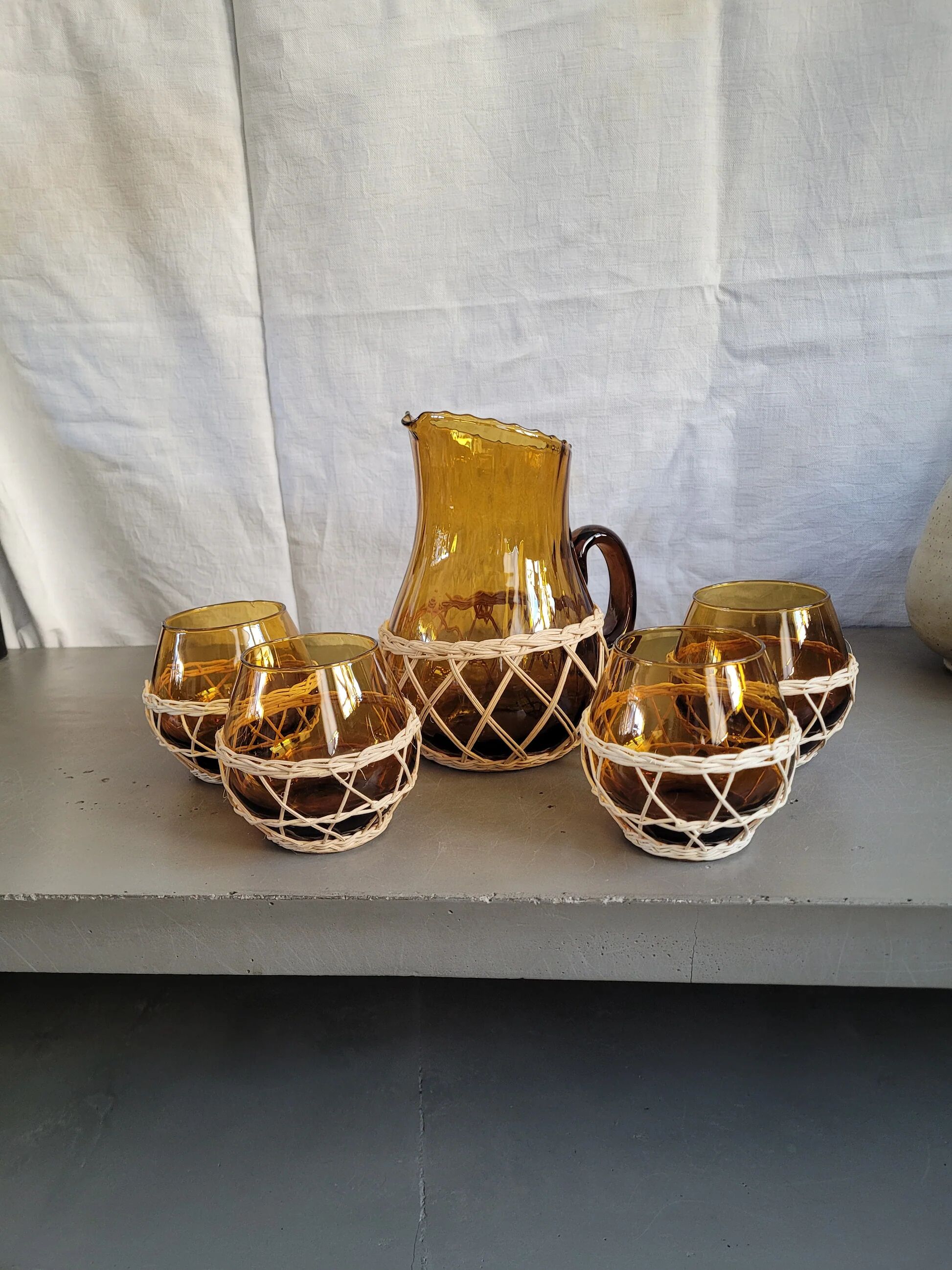 Amber glass and wicker lemonade service