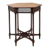 Hexagonal pedestal table or side table with a lattice structure and star pattern.