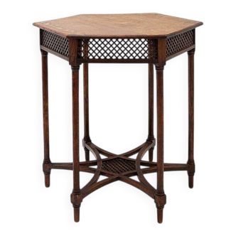 Hexagonal pedestal table or side table with a lattice structure and star pattern.