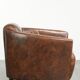 Cowhide armchair in Aviator design in a warm brown colour